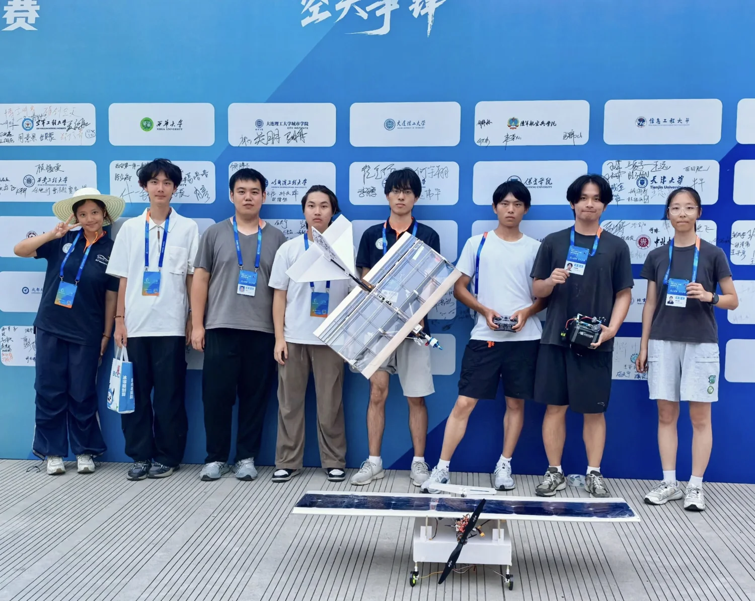 Aircraft team standing together at the competition with project aircraft